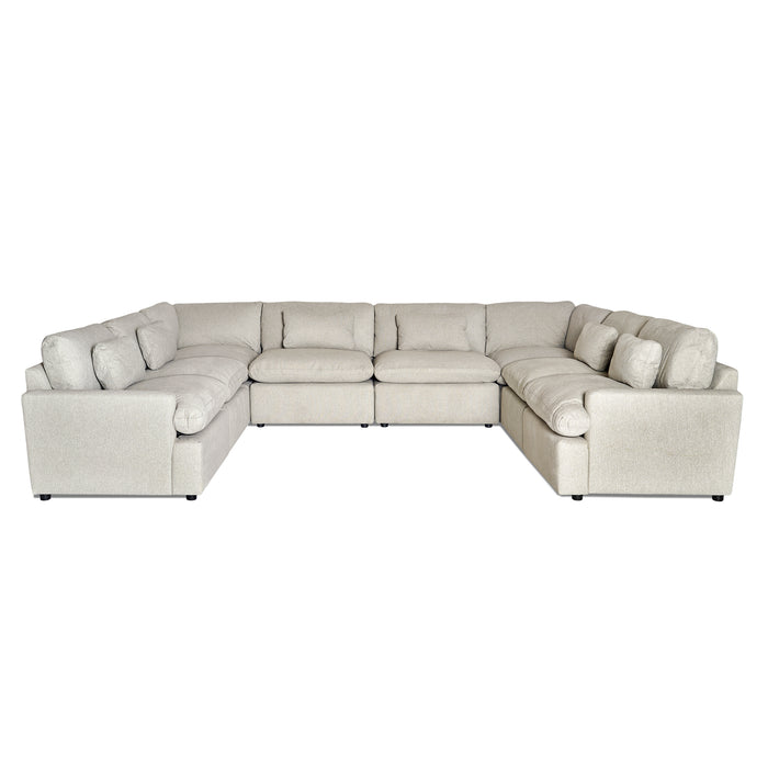The My Cloud 8 Piece Pit, celebrated as the Worlds Greatest & Most Comfortable Sofa, is a large, light gray L-shaped sectional featuring multiple cushions. Its soft fabric ensures comfort, while short black feet provide support for its customizable design in a spacious layout.