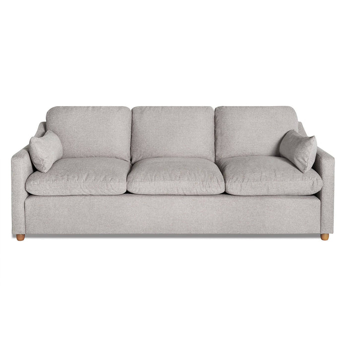 The My Cloud Slope Sofa features a modern gray design with three seat and back cushions for customizable comfort. It has sleek lines, armrests, and is supported by small round wooden legs. Two matching throw pillows on each end enhance its coziness.