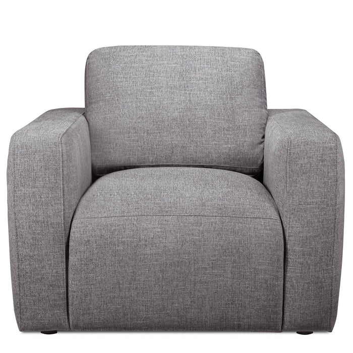 The Lugano Chair is a modern, gray upholstered armchair made from premium materials. It features wide armrests, a cushioned backrest, and a minimalist boxy design that reflects Italian luxury, making it ideal for contemporary interiors as part of the Lugano Sofa Set.