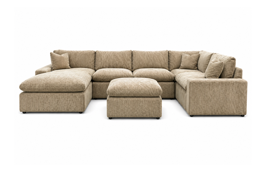 A large, plush gray sectional sofa with a matching ottoman is displayed in a showroom. A sign above reads, MY CLOUD: The Worlds Greatest & Most Comfortable Sofa. A bison image is in the background.