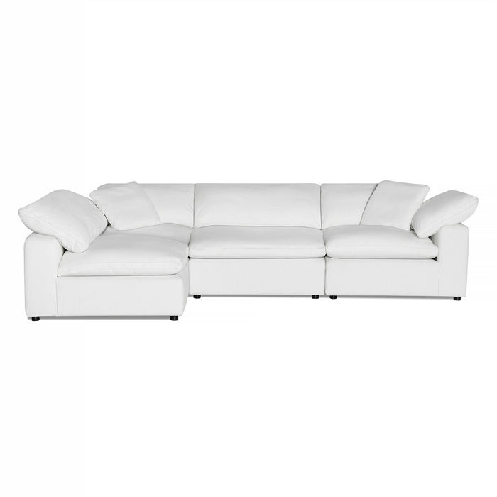 The Peyton 4 Piece white sectional sofa radiates luxury with its three seats and left-side extended chaise. Wrapped in smooth fabric and plush cushions, it appears on a plain white background, perfect for enhancing any elegant living space.