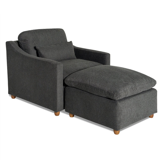 The My Cloud Slope Chair in dark gray features a cushioned backrest, seat, and wooden legs. It includes a matching pillow for comfort and offers a customizable, modern design that suits any space.