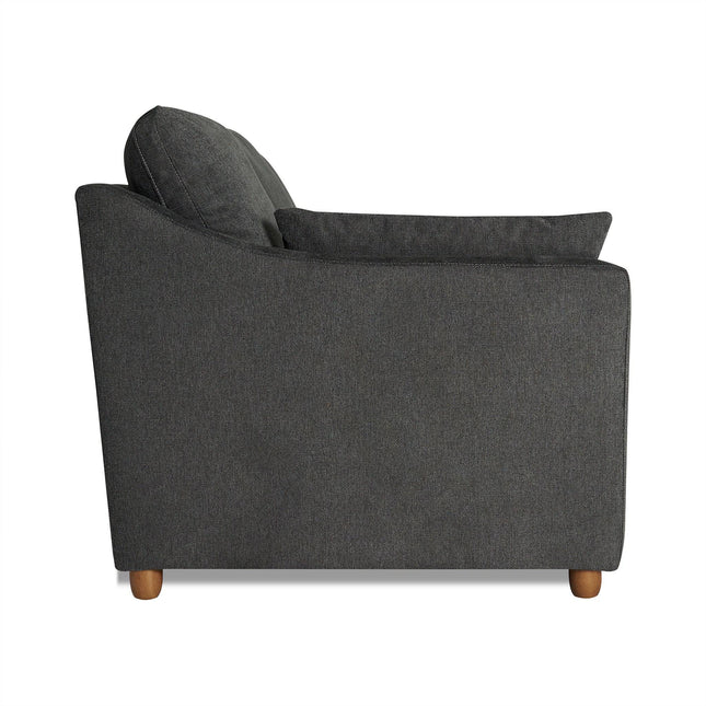 Side view of the My Cloud Slope Sofa in dark gray with a modern, minimalist design. It features two cushions, slightly rounded armrests, and small wooden legs. This customizable piece stands upright against a white background.