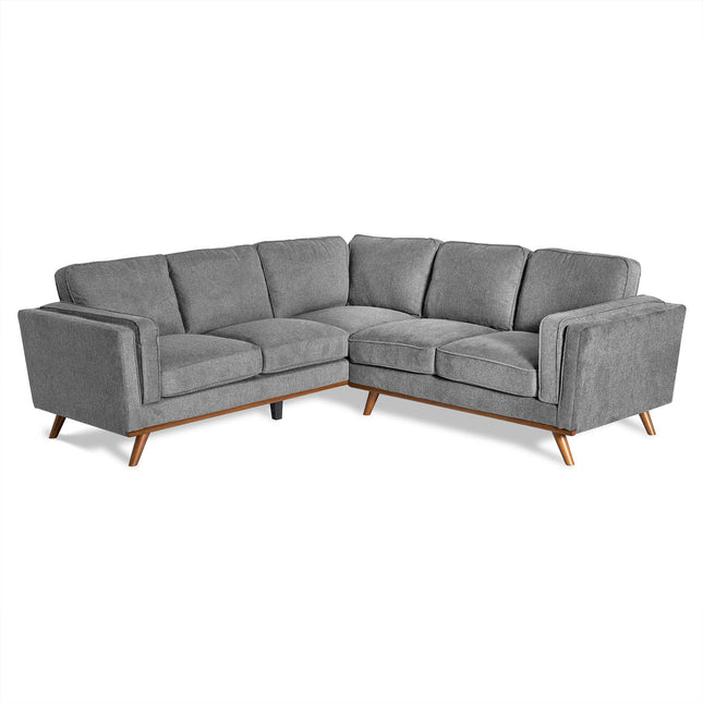 The Maddox sectional sofa, in a modern gray finish, exudes mid-century charm with an L-shape design. It features three cushioned seats per side, angled wooden legs, straight armrests, and smooth upholstery—perfect for any living room.