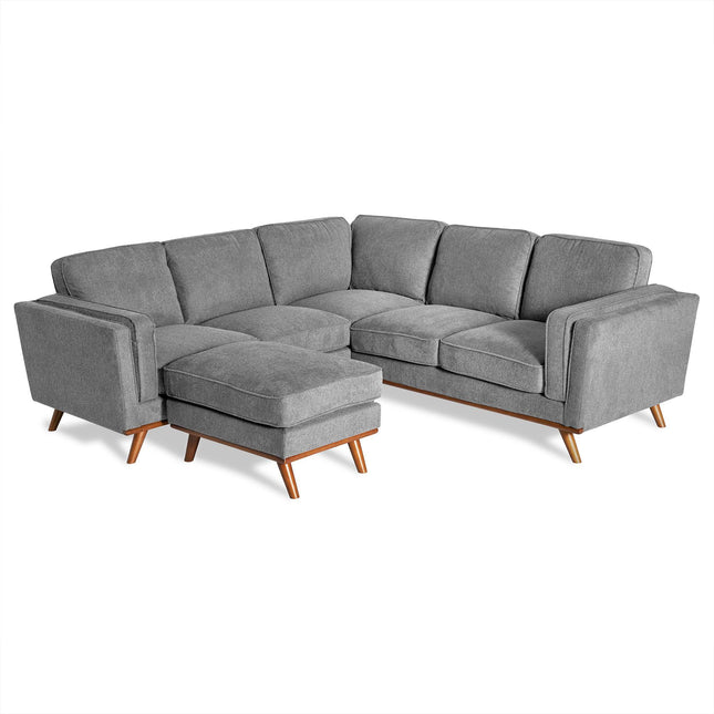 The Maddox is a grey L-shaped sectional sofa with wooden legs, designed in a mid-century modern style. It has plush cushions and a left-side chaise, making it a stylish and comfortable seating choice for any living room.