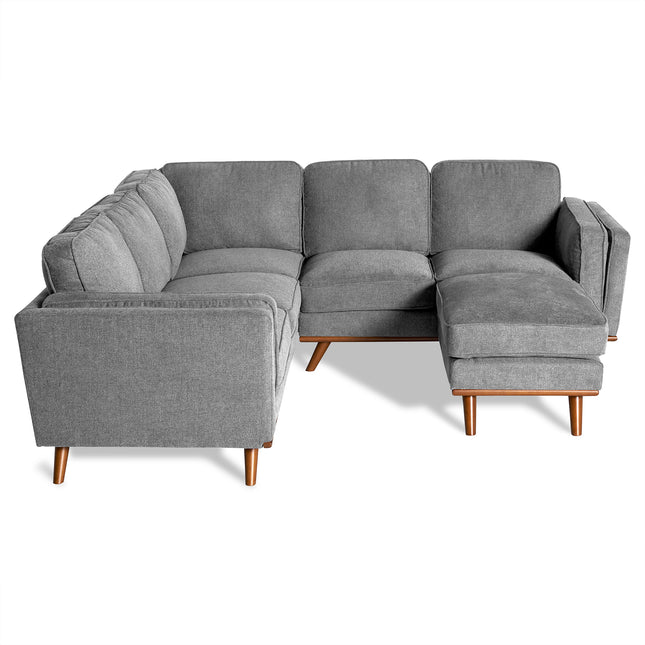 The Maddox is a gray L-shaped sectional sofa with wooden legs, ideal for a mid-century modern living room. It features three segments, including a right-side chaise lounge, all set against a white background.