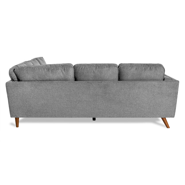 The Maddox is a gray, mid-century modern sectional sofa displayed from the back. Perfect for a stylish living room, it includes three back cushions and tapered wooden legs against a plain white background.