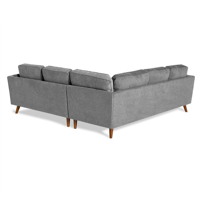 The Maddox is a gray L-shaped sectional sofa with wooden legs, epitomizing mid-century modern style. Its plush, evenly spaced back cushions add comfort and chic appeal, making it an ideal living room centerpiece. Photographed against a crisp white background, it exudes elegance.