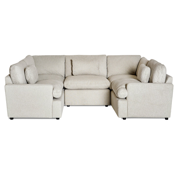 The My Cloud 5 Piece Pit is a large beige U-shaped modular sectional sofa with multiple cushions. Its soft upholstery and customizable modern, minimalistic design make it ideal for a spacious living room.