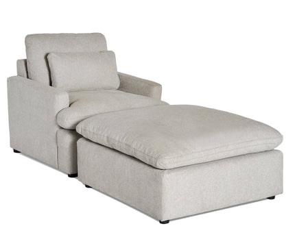 The My Cloud Chair is a light gray, modern sectional chaise lounge with cushioned backrests and armrests. It features a soft rectangular seat cushion and a matching large ottoman for customizable seating and ultimate relaxation.