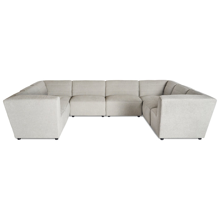 The Millenium 8 Piece Pit is a large, light gray L-shaped modular sectional sofa offering ultra-plush comfort with cushioned seats and backrests. Its modern design features clean lines and small black legs.