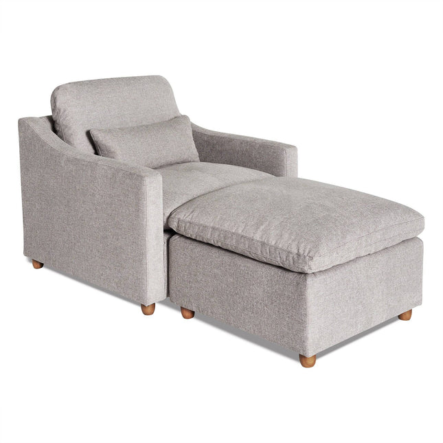 The My Cloud Slope Chair is a gray upholstered chaise lounge offering comfort with its cushioned backrest and seat, including a matching pillow and short wooden legs, making it the epitome of comfortable furniture.