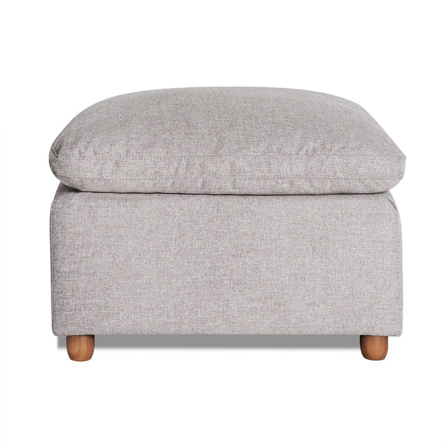 The My Cloud Slope 30 Ottoman in gray features a cushioned top and wooden legs, offering a blend of comfort and modern design. Its textured fabric enhances both style and comfort.