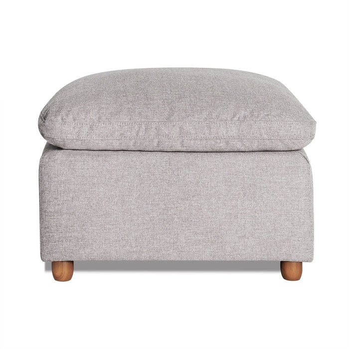 The My Cloud Slope 30 Ottoman in gray features a cushioned top and wooden legs, offering a blend of comfort and modern design. Its textured fabric enhances both style and comfort.
