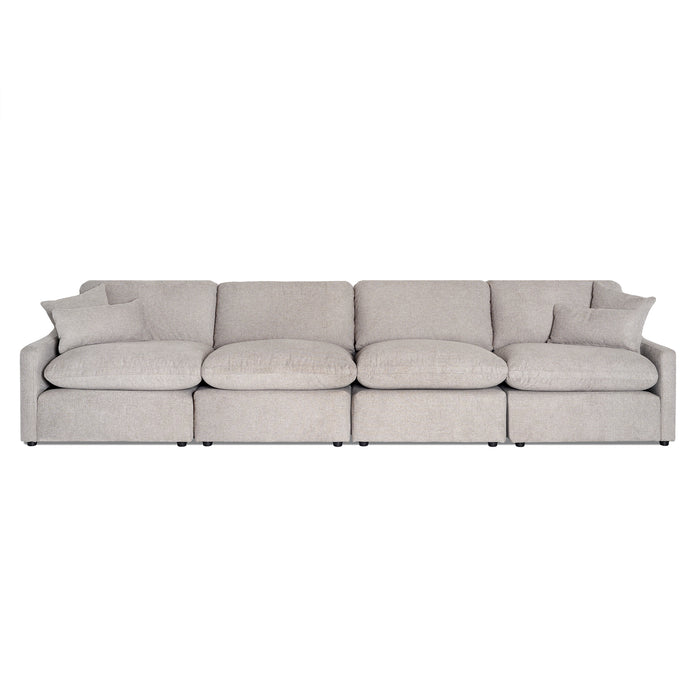 The My Cloud Slope 4 Piece Straight is a spacious gray modular sofa with four connected sections, featuring soft rounded cushions and matching throw pillows. Its minimalist design allows it to sit gracefully against a white backdrop.