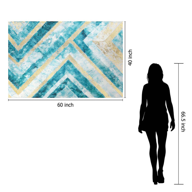 The Abstract Chevron is a museum-quality artwork with blue, teal, gold, and white geometric patterns on a decorative wall piece. It measures 60x40 inches on floating tempered glass, with a nearby silhouette at 66.5 inches tall for scale comparison.