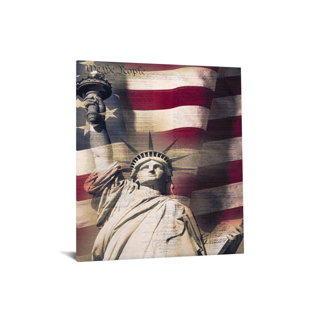 The We The People artwork captures the Statue of Liberty and a billowing American flag on floating tempered glass, with the U.S. Constitutions opening words overlaying it, creating a museum-quality piece that evokes patriotic pride and historical reverence.