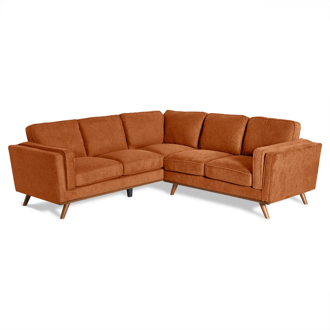 The Maddox is a mid-century modern L-shaped sectional sofa in burnt orange fabric with angled wooden legs. Featuring three back cushions and seat cushions per section, it enhances any living room with its cozy, minimalist design against a white background.