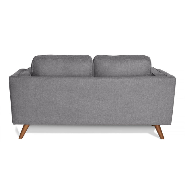 The image showcases the back of the Maddox Loveseat in gray, a mid-century modern piece with clean lines, two plush back cushions, and tapered wooden legs for an elegant and contemporary look.