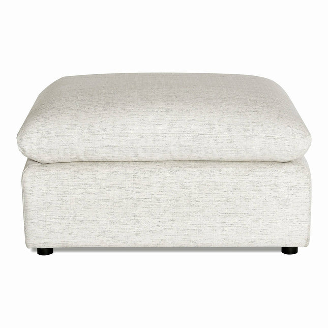 The My Cloud Slope 40 Ottoman, rectangular and light gray, blends comfort and style with its soft cushioned top. Its subtle fabric texture rests on small round black feet, making it a customizable piece suitable for seating or as a footrest.
