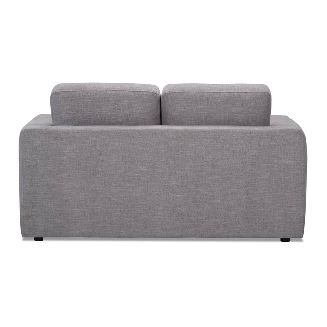 Rear view of the elegant Lugano Loveseat, featuring a modern gray upholstered design with plush back cushions. Its minimalistic style and clean lines, complemented by textured weave fabric and short black legs, exude Italian luxury.