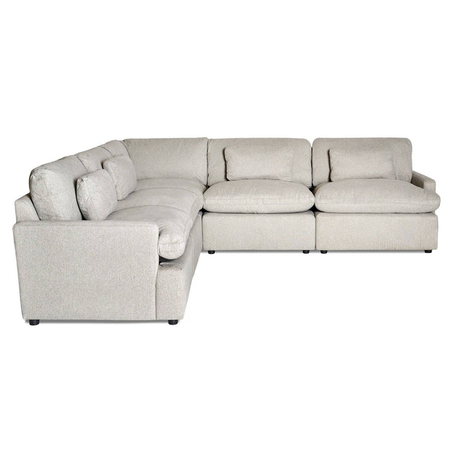 A light gray, L-shaped sectional couch with plush cushions, slightly tufted backrests, and broad seats is perfect for a modern living space. Get free fabric swatches to match your decor.