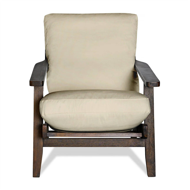 The Peyton Chair is a mid-century wooden armchair featuring light beige cushions, a sturdy dark brown frame, and wide armrests. Its thick seat and backrest offer comfort against a plain white background, showcasing timeless elegance.