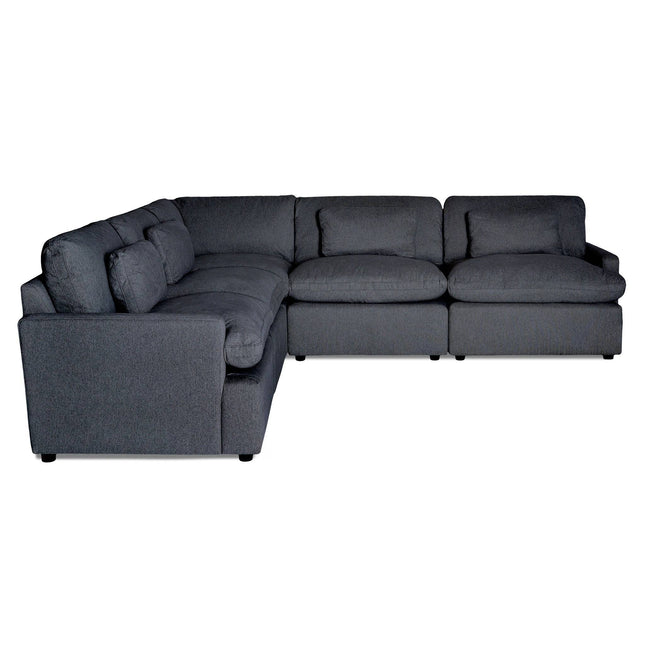 The Free Fabric Swatches feature a large, modern dark gray sectional sofa with plush cushions and a U-shaped design, ideal for a spacious living room. This sofa combines comfort with style, featuring soft, textured fabric for an inviting touch.