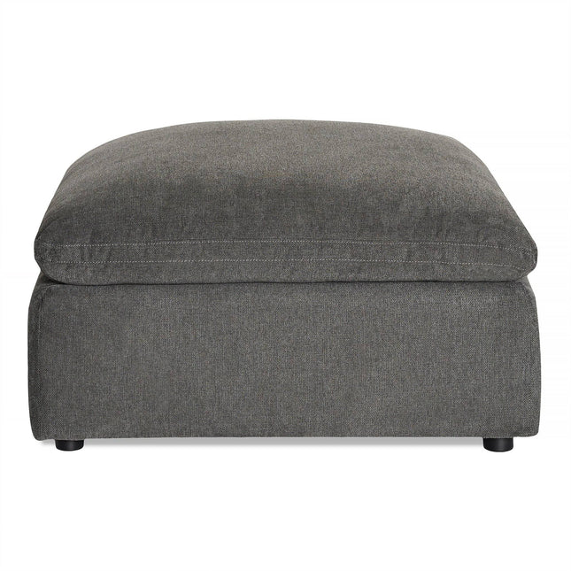 The My Cloud Slope 40 Ottoman offers large, square gray comfort with its cushioned top. It features a sleek fabric finish and short black legs, making it perfect customizable furniture for any living room or lounge with its simple, modern design.
