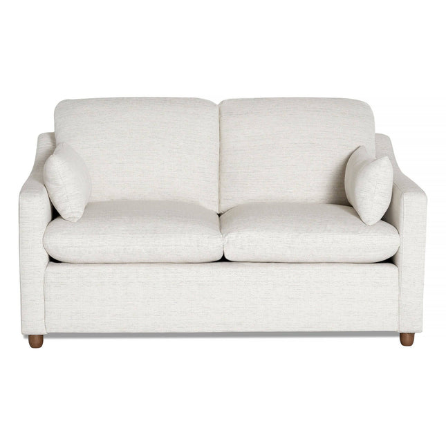 The cream-colored My Cloud Slope Loveseat features simple, clean lines with cushioned seats, two back cushions, and matching throw pillows. Its supported by four round wooden legs and exemplifies durable style and comfort.