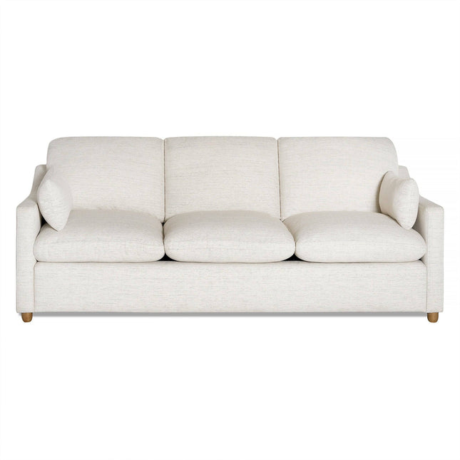 The My Cloud Slope Sofa is a modern, cream-colored piece with three cushions, a minimalist design, straight back, rounded armrests, and plush upholstery. It sits on short wooden legs and offers customizable comfort for a stylish contemporary living room setting.