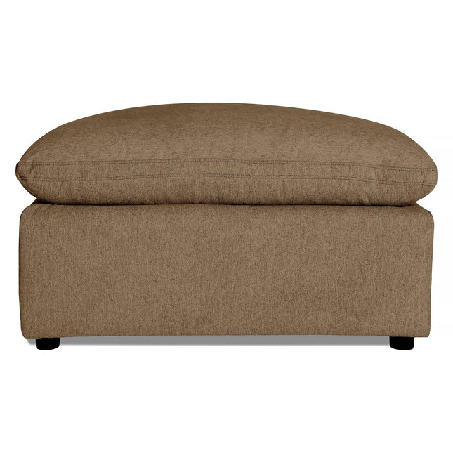 The My Cloud 40 Ottoman features a brown upholstered cushion atop a rectangular base with short black legs for minimal clearance. Its textured fabric enhances the cozy appeal, adding charm and comfort to any space.
