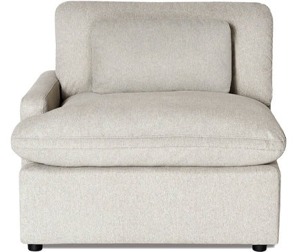 The My Cloud Left Arm chair is a modern, light gray upholstered sectional with a rectangular pillow. It seamlessly fits into any seating arrangement with its low, wide seat, cushioned backrest, left armrest, and elegant small black legs.