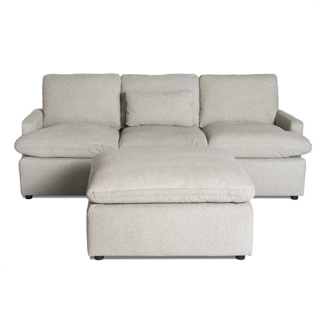 The My Cloud Sofa is a light gray sectional offering three seats and a matching ottoman. With plush cushions and armrests, it provides customizable comfort in modern seating. The ottoman is slightly lower and positioned at the front for relaxation.