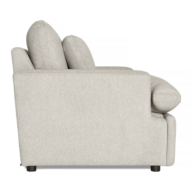 Side view of the My Cloud Power Recliner in light gray, featuring thick cushions and a low backrest. This modern piece of comfortable furniture is supported by short black legs, with soft, textured fabric for an inviting feel—perfect for relaxation in any living space.