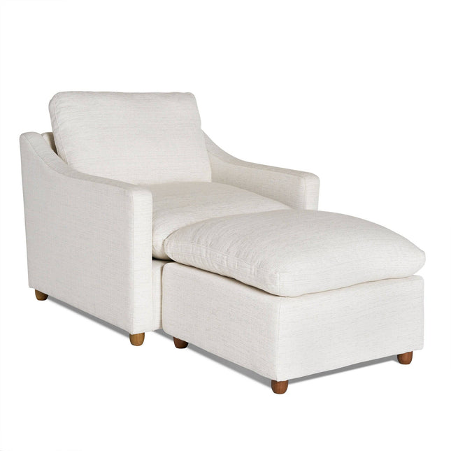 Experience ultimate relaxation with the My Cloud Slope Chair, a white upholstered chaise lounge with a matching cushion and ottoman. Featuring track arms and wooden feet, this comfortable furniture piece blends modern elegance with customizable options for your perfect fit.