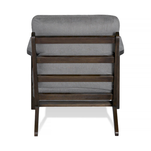 Back view of the comfortable, mid-century Peyton Chair featuring a dark brown frame, soft gray cushions, horizontal slats on the backrest, and simple angled legs.