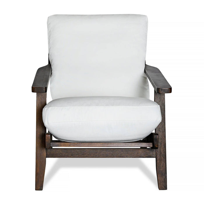Meet the Peyton Chair: a stylish armchair with a white cushion, complemented by dark wooden armrests and legs. Its minimalist design offers a sophisticated mid-century nod, beautifully displayed on a simple white background.