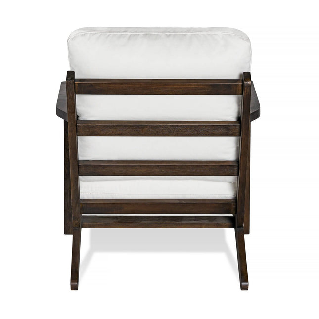 View of the Peyton Chair from behind, displaying its dark brown frame and white cushioned backrest. The mid-century design features horizontal slats and angled legs, blending elegance with comfort.