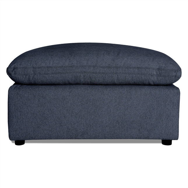 The My Cloud 40 Ottoman is a rectangular gray piece with a cushioned top for exceptional comfort. It features small black feet and sits against a white background, offering customizable style and relaxation to any space.