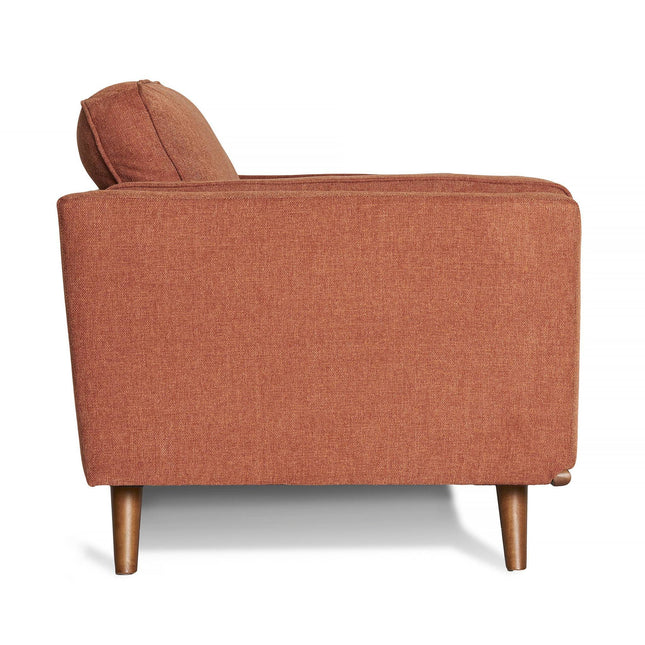 The Maddox Loveseat boasts a mid-century modern design in burnt orange fabric, showcasing square armrests, plush cylindrical back cushions, and wooden tapered legs.