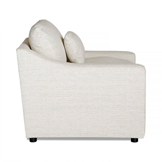 Side view of a modern, light beige My Cloud Slope Power Recliner with two cushions. It features a sleek, minimalist design and black cylindrical legs, combining stylish appeal with the luxury of customizable furniture.
