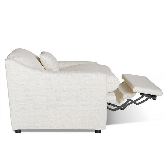 Side view of the beige upholstered My Cloud Slope Power Recliner with an extended footrest revealing the mechanism. This comfy piece features plush cushions and armrests, set on dark wooden legs against a white background.