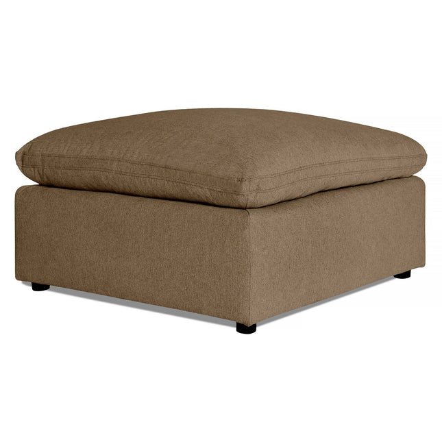 The My Cloud 40 Ottoman is a large square piece with beige textured fabric. Its plush, soft cushioned top offers comfort, while simple black feet at each corner enhance its understated elegance.