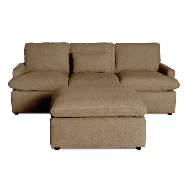 The My Cloud Sofa, a beige sectional featuring three cushions and armrests, offers customizable options. Enhanced by a matching ottoman placed in front, it creates a cozy and inviting setup.
