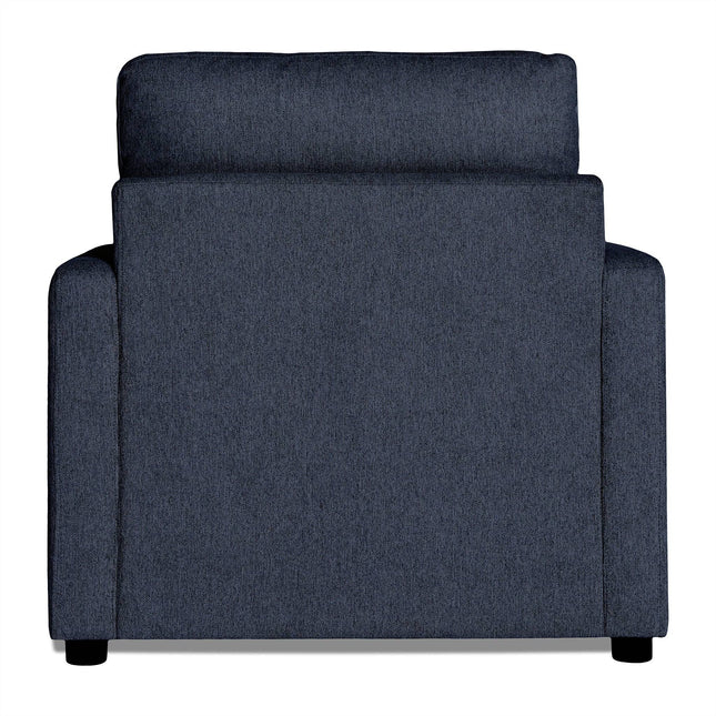 Rear view of My Cloud Chair, a modern dark gray fabric armchair with a squared silhouette created by the towering backrest over the armrests. The textured upholstery appears soft and inviting, suited for comfort seekers, all set against a white background.